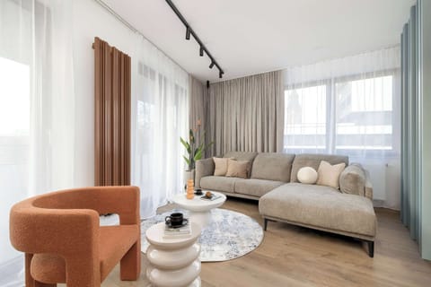 Relax in the stylish living room with a comfortable sofa and cosy decor.