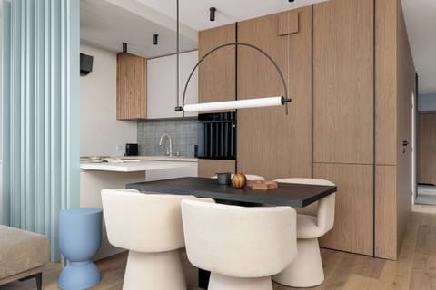 The living room's modern and stylish decor creates a welcoming atmosphere.