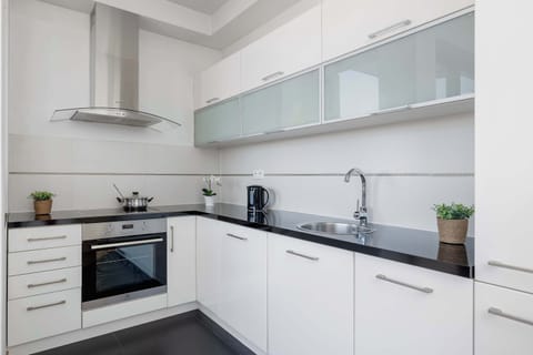 The fully equipped kitchenette includes everything you need for a home-cooked meal.