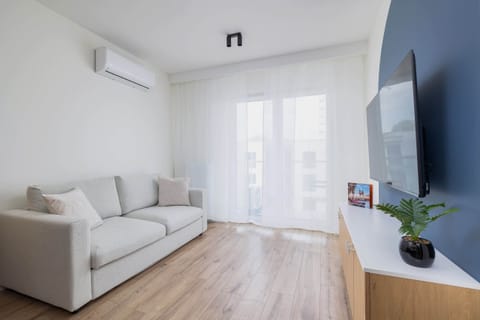 Bright and relaxing living room with a comfortable sofa and modern decor.

