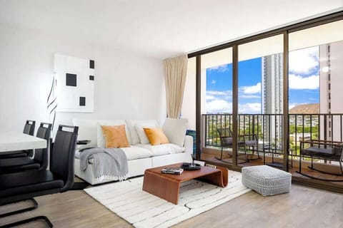 Your perfect retreat awaits, offering an inviting living room with direct balcony access, ideal for unwinding after a day of exploration.