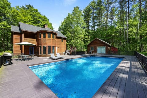 Expansive pool deck with plenty of space for lounging, grilling, and soaking up the sun.