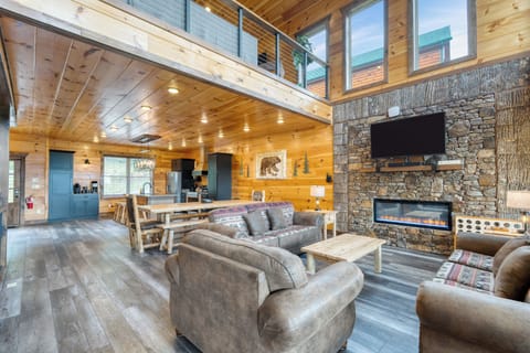 Living room features a fireplace and TV. (Duval)