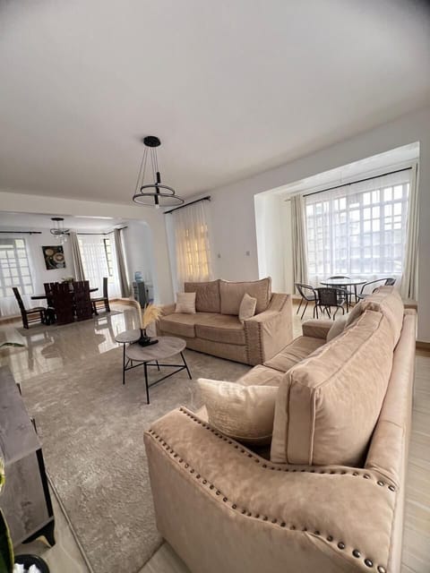 Deluxe Apartment, Garden View | Living area | 32-inch Smart TV with digital channels