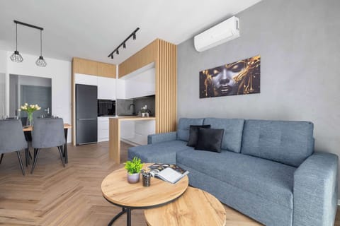 Relax in the stylish living room with a comfortable sofa and modern decor.