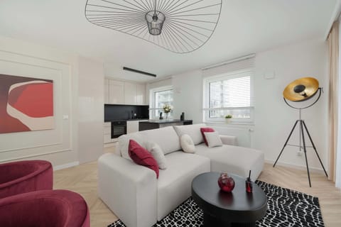 Relax in the stylish living room with a comfortable sofa and modern decor.