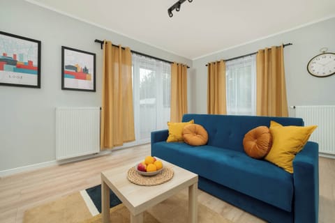 Living room with a comfortable sofa and TV.