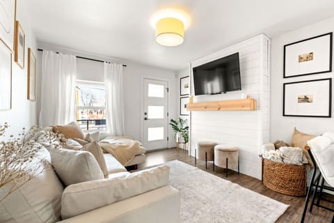 Beautiful living space filled with natural light, comfortable seating and smart TV