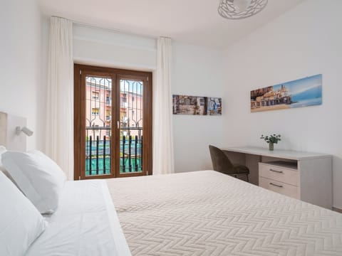 Comfort Apartment, Balcony, City View | Down comforters, desk, laptop workspace, blackout drapes