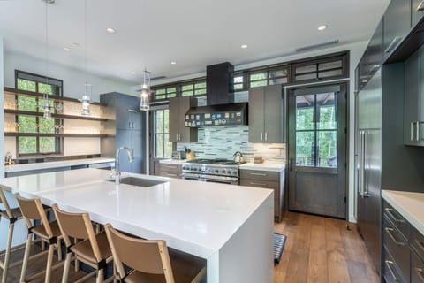 Kitchen - Fully appointed chefs kitchen with bar seating for 4