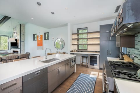 Kitchen - Fully equipped with a wolf double oven, wine fridge and deck access