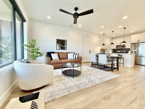 Modern living space with comfy seating, mountain views & smart TV — unwind after a day of exploring in your stylish home away from home