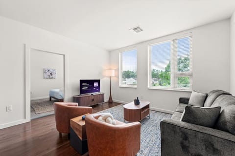 Full-size sofa with accent seating and contemporary furnishings.