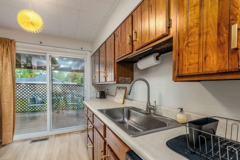 Sunshine & suds! Wash up at the kitchen sink with a view, load the dishwasher with ease, then step through the sliding door to the covered deck and let the breeze in.