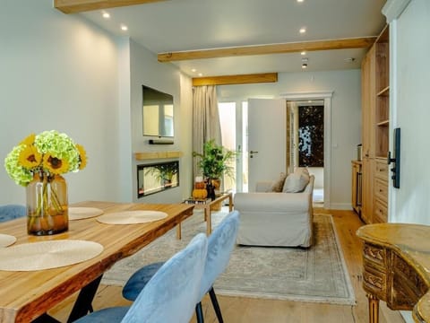 Suite, City View | Living area | 65-inch Smart TV with cable channels, fireplace