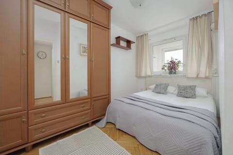 A spacious wardrobe and soft bedding create perfect conditions for a restful sleep.