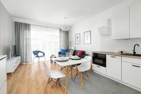 A bright dining area with a large window makes for the perfect spot to enjoy morning coffee with a green view.