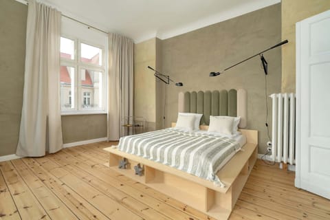 This cozy bedroom features a comfortable double bed, perfect for restful nights. The soft color palette and natural light create a warm atmosphere.