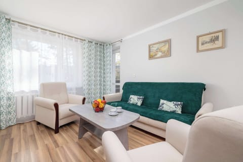 Living room with a comfortable sofa and TV. 