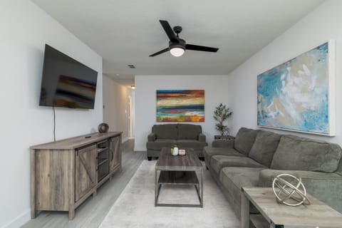 Spacious living room with plenty of seating for friends and family.