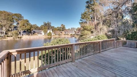 Peaceful back deck overlooking the marsh and pond, ideal for quiet moments.