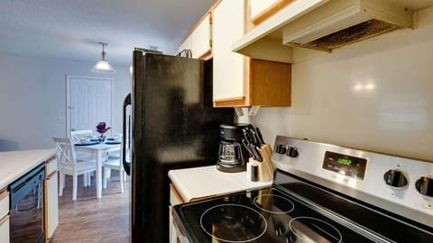 Kitchen with coffee maker and essentials ready for easy mornings and simple meals.