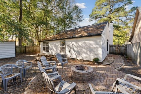 Gather around the backyard fire pit for cozy evenings under the stars.