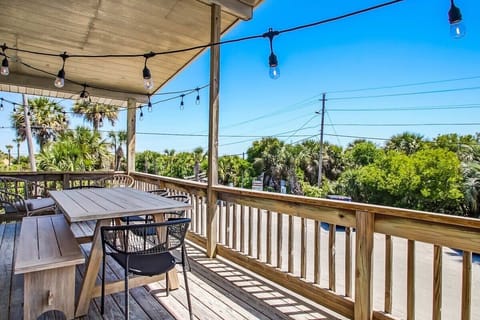 Covered deck perfect for morning coffee with stunning blue sky views.
