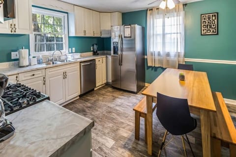 Clean, bright kitchen with white cabinetry and modern finishes.
