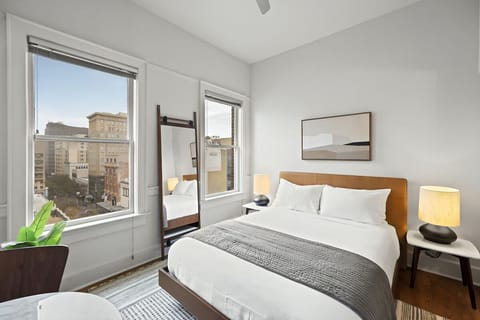 Wake up to sunlit comfort and sweeping city views.