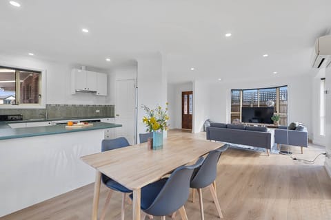 Modern open-plan living with a seamless flow from the dining area to the spacious lounge. Stylish ti