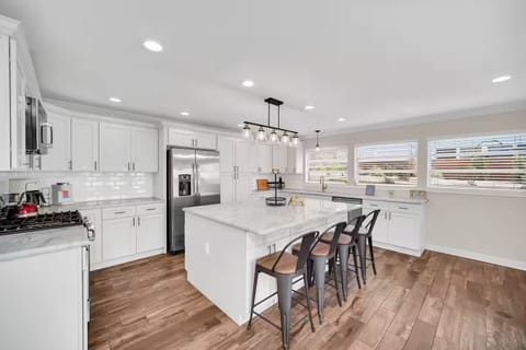 Fully equipped kitchen with stainless steel appliances & huge kitchen island