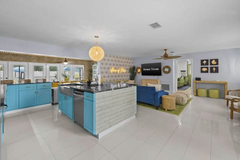 Where everyone can be together—our open floor plan seamlessly connects the living room and kitchen, so no one ever misses a moment (or a snack!).