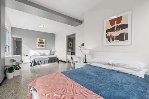 This well-arranged studio combines comfort with functionality, featuring a cozy bed and a convenient desk area, perfect for both leisure and work.