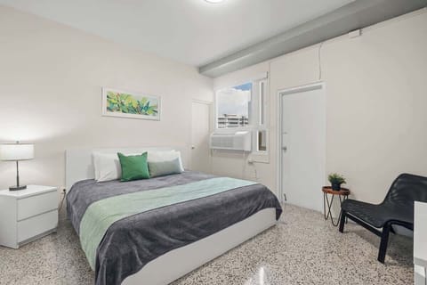 Step into a clean and comfortable space designed for your relaxation. This bright bedroom offers a tranquil setting for a perfect night's sleep.