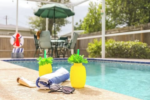 Dive into your own screened-in pool, offering a peaceful, bug-free retreat with sparkling waters and lush surroundings—perfect for unwinding any time of day.