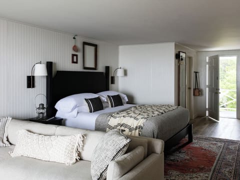 Unwind in a calm, spacious room with plush pillows.