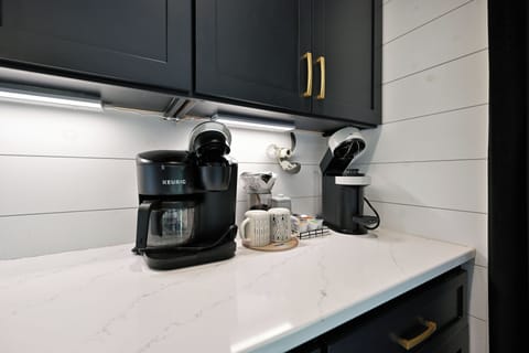 Kitchen - Kitchen with a drip coffee pot or individual Keurig cups.