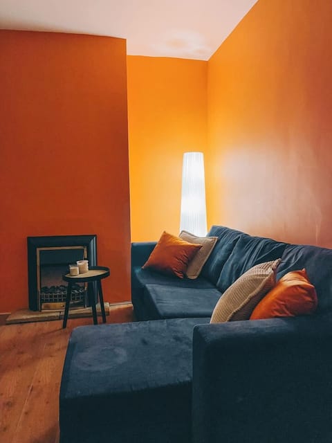 A cozy living room with soft lighting, plush seating, and warm, inviting decor perfect for relaxation and gatherings.