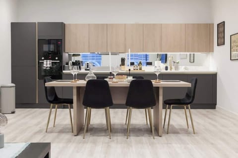 The dining area is a designated space for meals, typically featuring a table and seating.