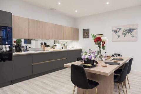 The dining area is a designated space for meals, typically featuring a table and seating.