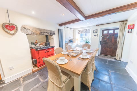 Dixon Ground Farm dining room with flag stone floor and table for 6