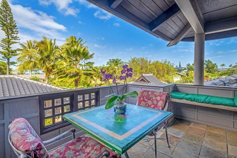 Deck overlooking courtyard and distant vieew of ocean.