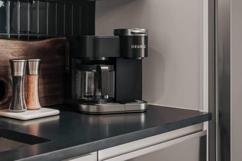Coffee lovers will appreciate the Keurig Duo, offering the flexibility to brew both K-Cups and fresh local ground coffee—both of which are thoughtfully provided for your stay.