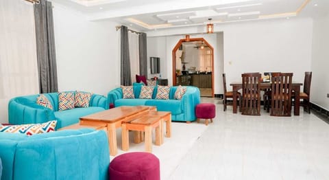Family Apartment, City View | Living area | 32-inch Smart TV with digital channels