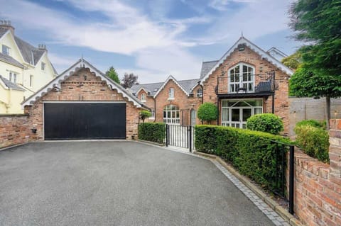 A view from the private driveway of this breathtaking home, your base for exploring Manchester