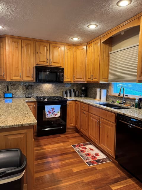 Large kitchen with dishwasher, garbage disposal, coffee maker, fully equipped