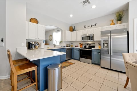 Stocked Kitchen with Quartz Counter and stainless steel appliances