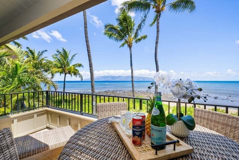 Enjoy your morning coffee or evening cocktails on this spacious lanai overlooking the sparkling blue waters
