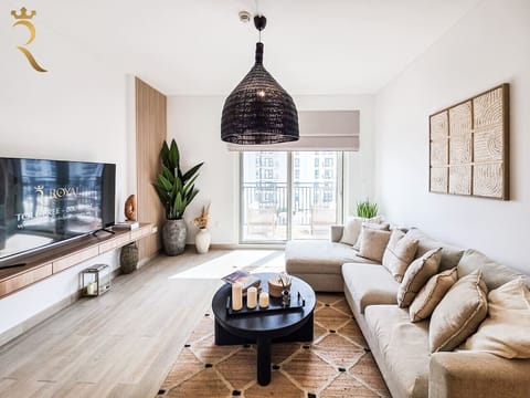 Modern living room with colorful artwork and contemporary furniture arrangement throughout.